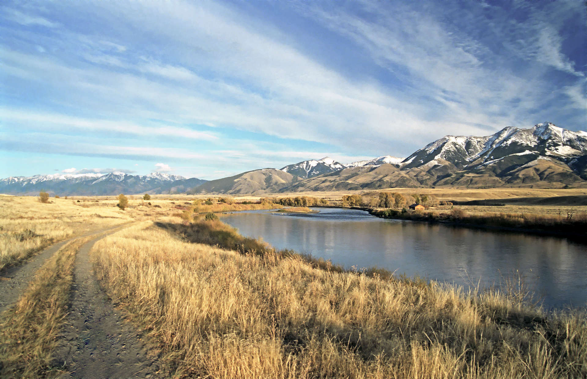 The Yellowstone River winding beneath snow-capped Montana mountains near Bozeman